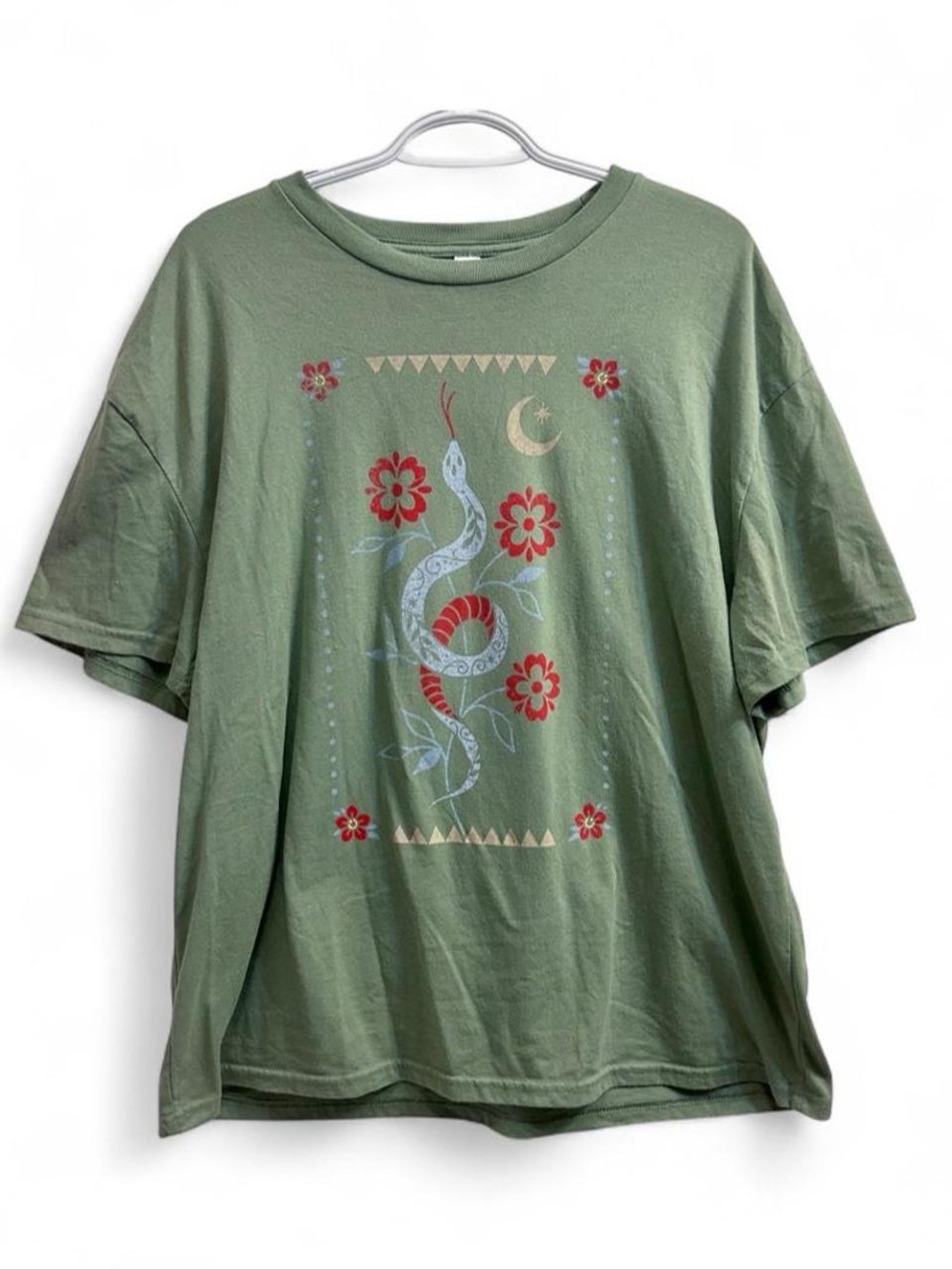 Green snake graphic tee with floral design